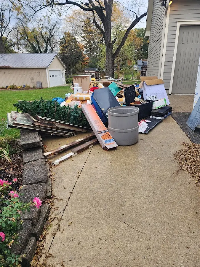 Dumpster being loaded with debris for 12 Yard Dumpster Rental in Yorkville